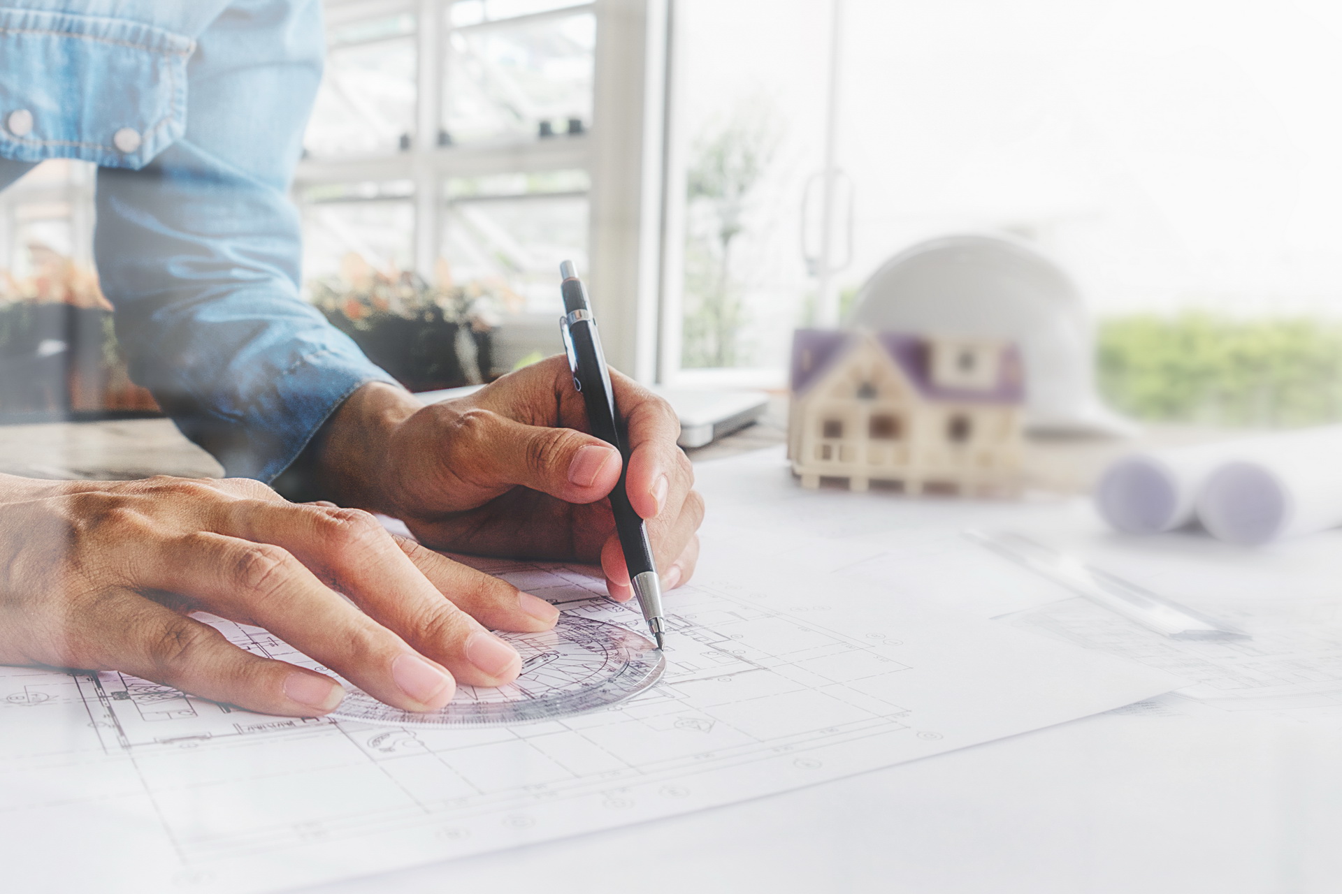 Hands of Engineer working on blueprint,Construction concept. Engineering tools.Vintage tone retro filter effect,soft focus(selective focus)